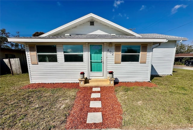 bungalow-style house with a front yard