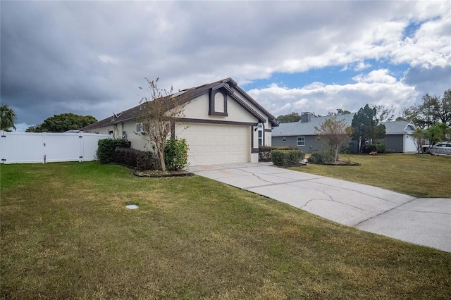 view of front of property featuring a front lawn and a garage