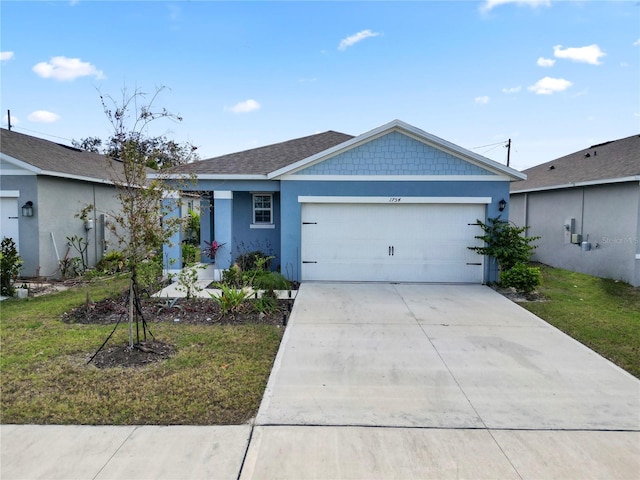 single story home featuring a front yard and a garage