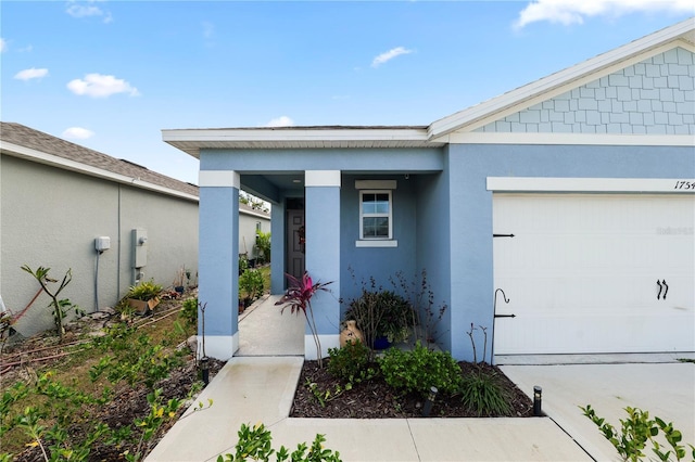 view of exterior entry featuring a garage