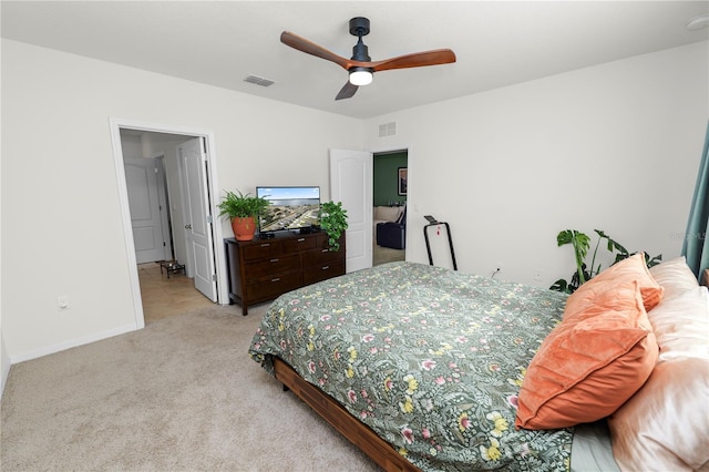 bedroom with light colored carpet and ceiling fan