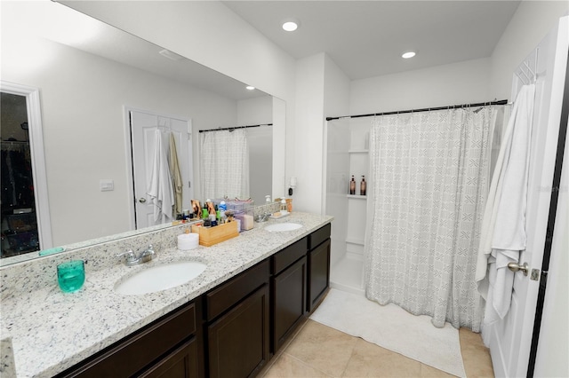 bathroom featuring tile patterned floors and vanity