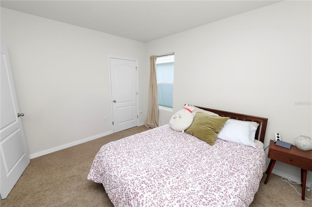 bedroom with light carpet