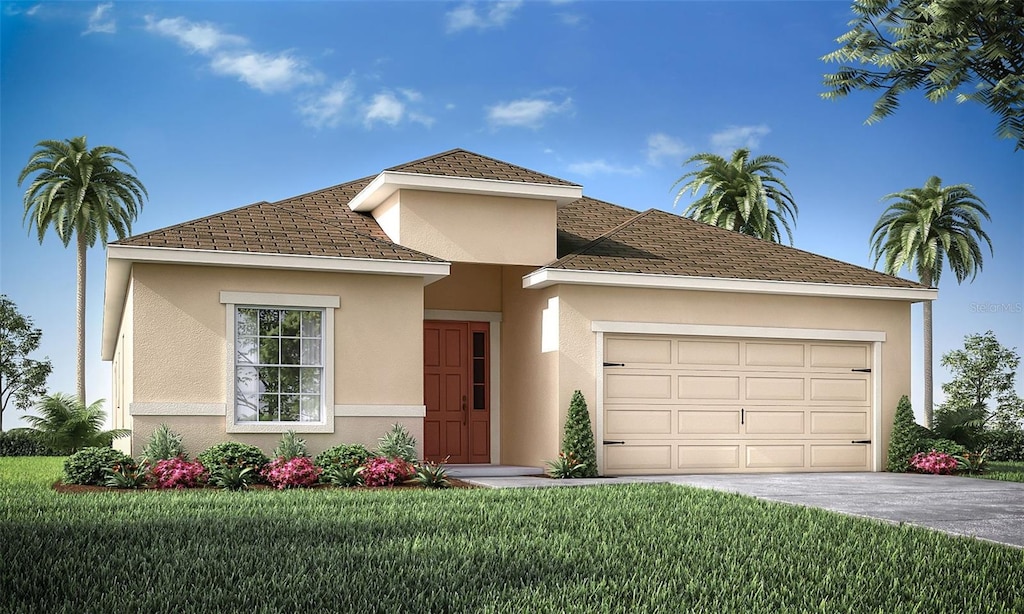 view of front facade with a front yard and a garage