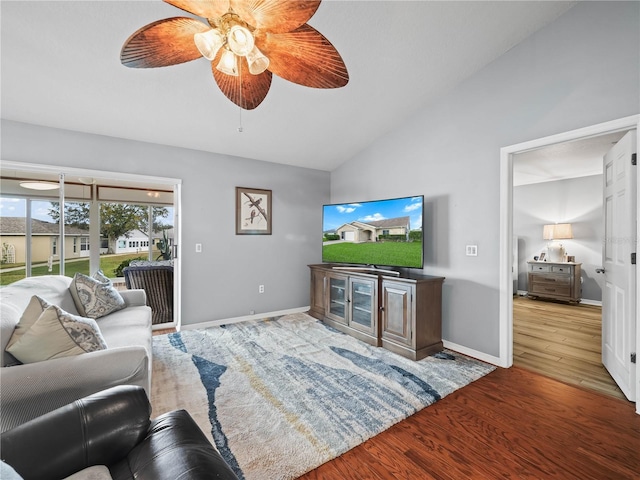 living room with wood-type flooring, ceiling fan, and lofted ceiling