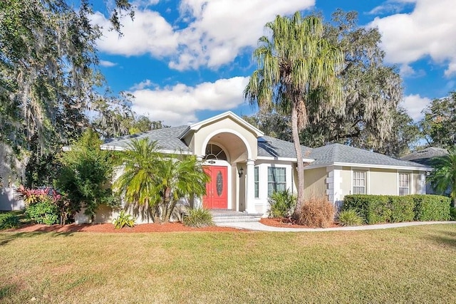 ranch-style house with a front lawn