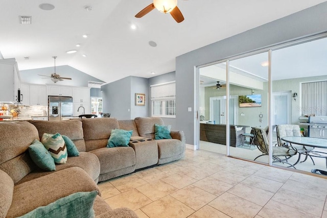 tiled living room featuring lofted ceiling