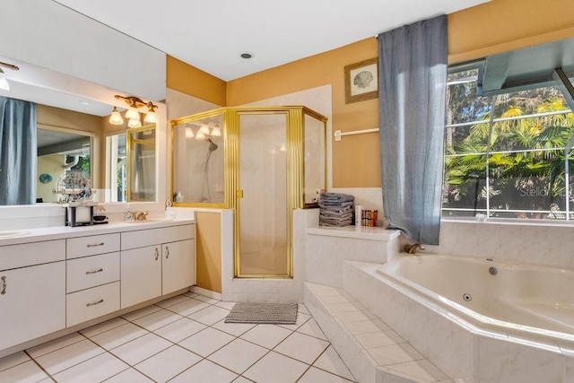 bathroom with tile patterned floors, separate shower and tub, and vanity