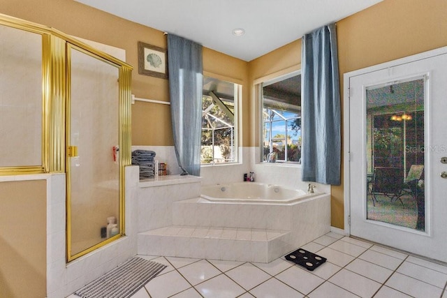 bathroom featuring tile patterned flooring and independent shower and bath