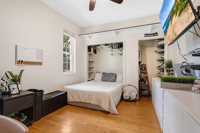 bedroom with ceiling fan, a closet, and light hardwood / wood-style floors