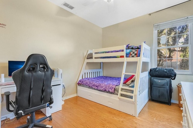 bedroom with ceiling fan and light hardwood / wood-style floors