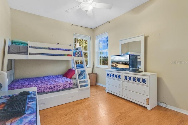 bedroom with ceiling fan and hardwood / wood-style floors