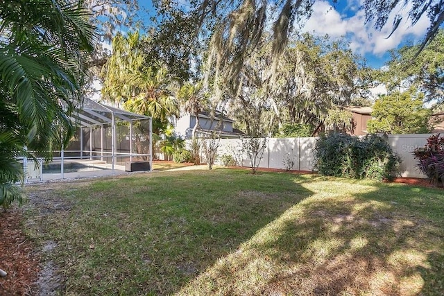 view of yard featuring a lanai