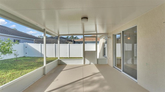 unfurnished sunroom with plenty of natural light