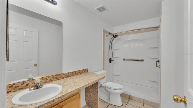 bathroom with tile patterned flooring, a shower, vanity, and toilet