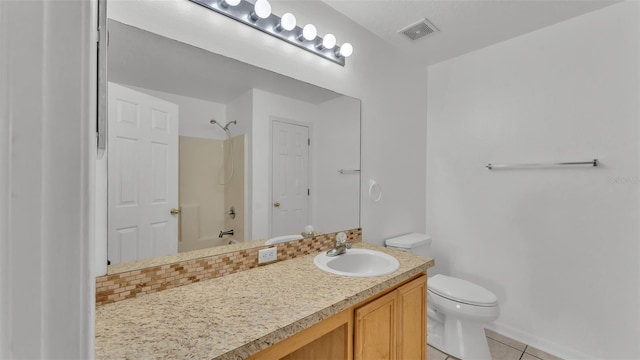 full bathroom with tile patterned floors, vanity,  shower combination, and toilet