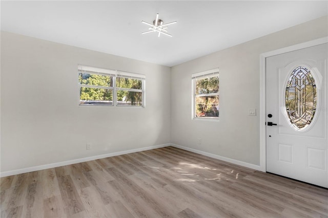 foyer with light hardwood / wood-style flooring