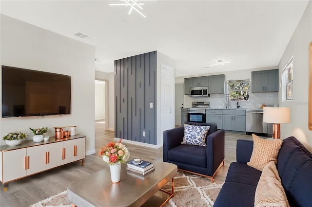 living room with light hardwood / wood-style floors