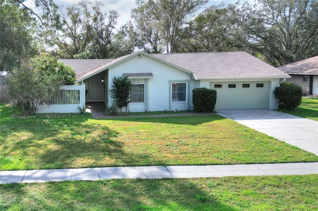 single story home featuring a front yard and a garage