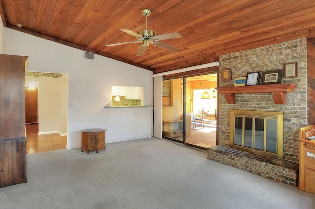 unfurnished living room featuring ceiling fan, a fireplace, wooden ceiling, and vaulted ceiling