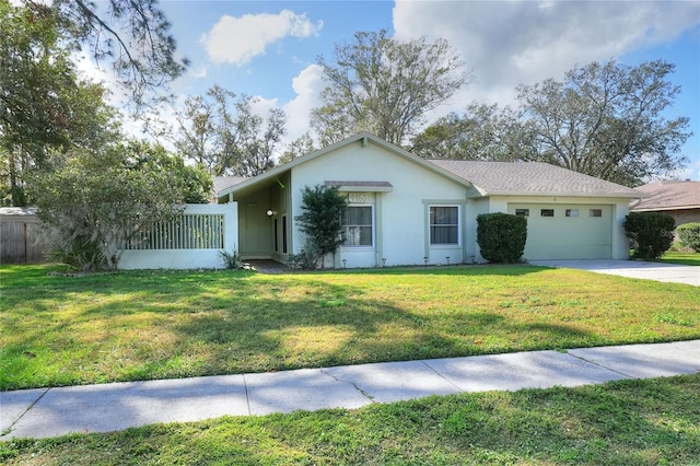 ranch-style home featuring a garage and a front yard