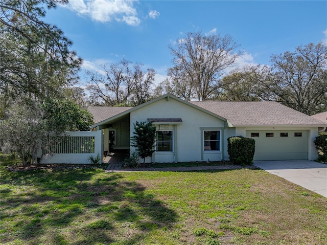 single story home featuring a front lawn and a garage