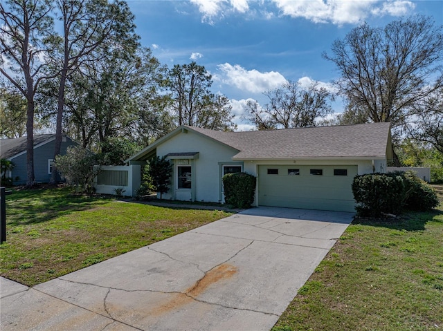 single story home with a garage and a front yard