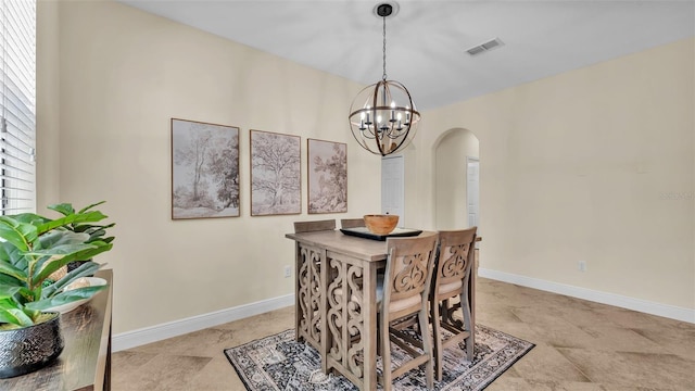 dining space with plenty of natural light and a chandelier