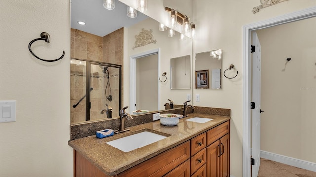 bathroom with an enclosed shower and vanity