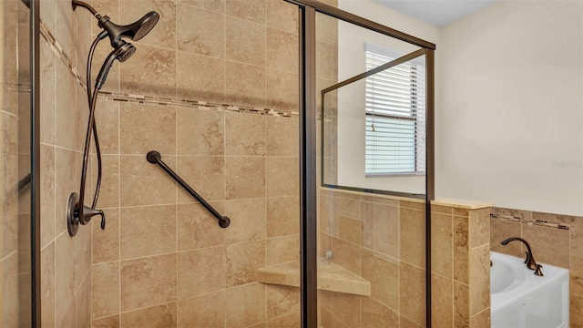 bathroom with separate shower and tub