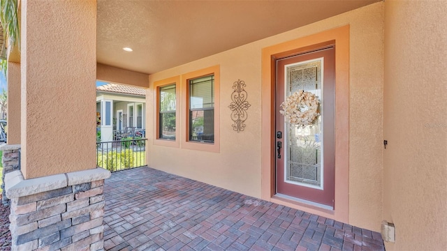 property entrance with covered porch