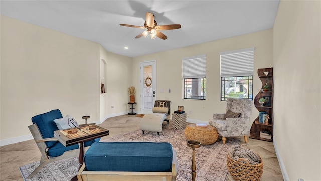 sitting room with ceiling fan