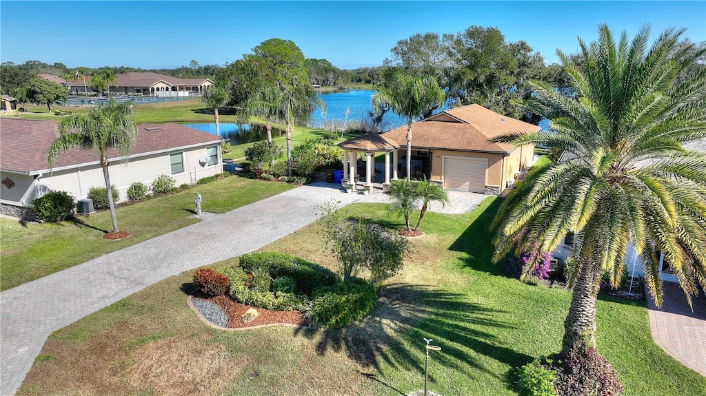 birds eye view of property with a water view