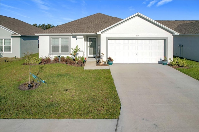 ranch-style home featuring a garage and a front lawn