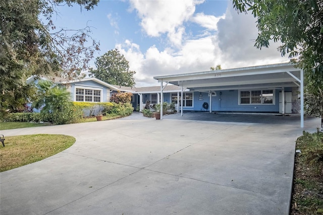 single story home with a carport