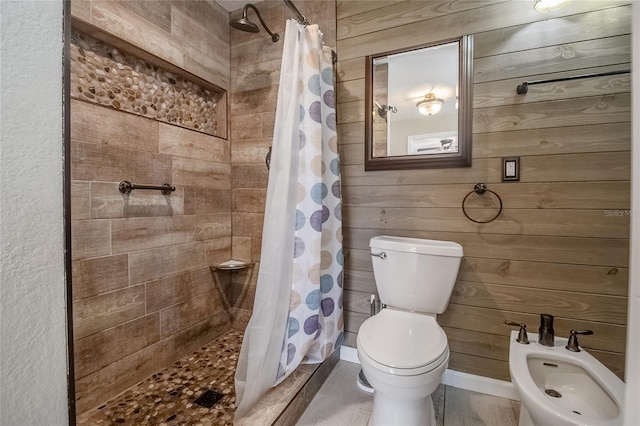 bathroom with a bidet, wooden walls, and walk in shower