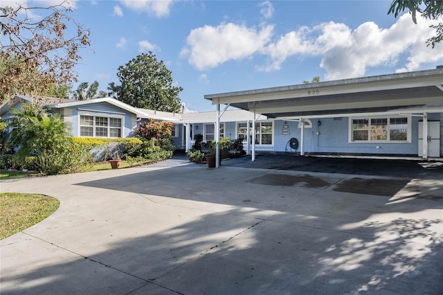 exterior space with a carport