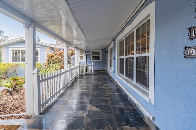 view of patio featuring a porch