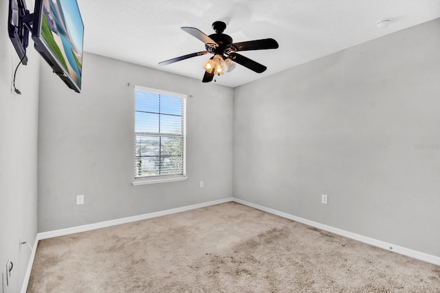 carpeted empty room with ceiling fan