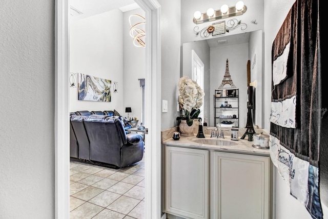 bathroom with tile patterned floors and vanity