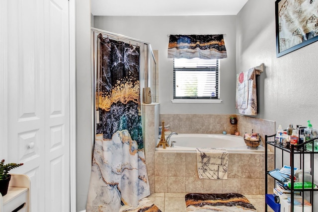 bathroom featuring tile patterned flooring and shower with separate bathtub