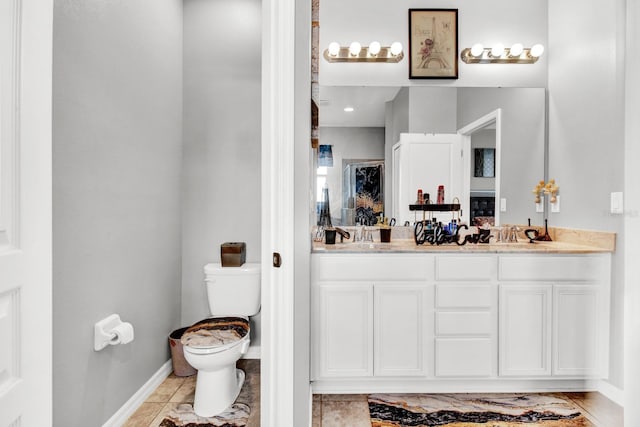 bathroom with a shower, tile patterned flooring, vanity, and toilet