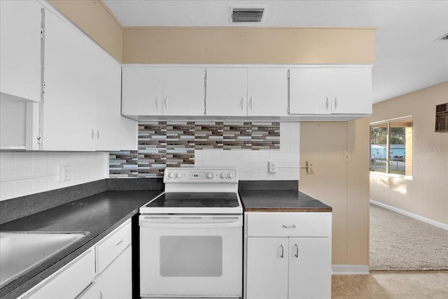 kitchen with white electric range oven, decorative backsplash, white cabinetry, and light tile patterned flooring