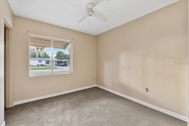 carpeted empty room with ceiling fan