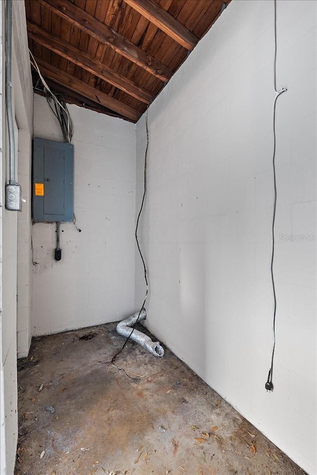 basement featuring wood ceiling and electric panel