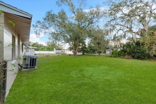 view of yard with central air condition unit