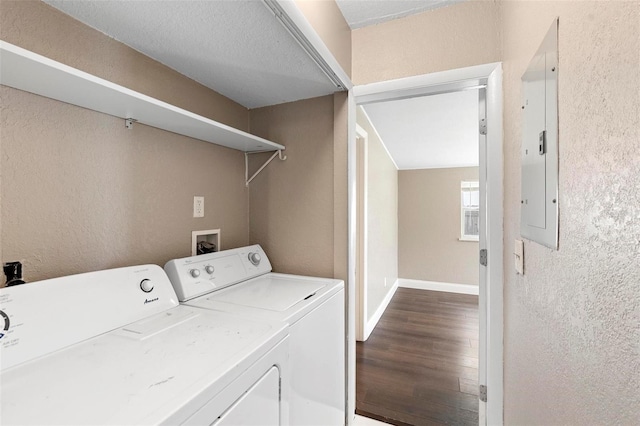 clothes washing area featuring hardwood / wood-style floors and independent washer and dryer