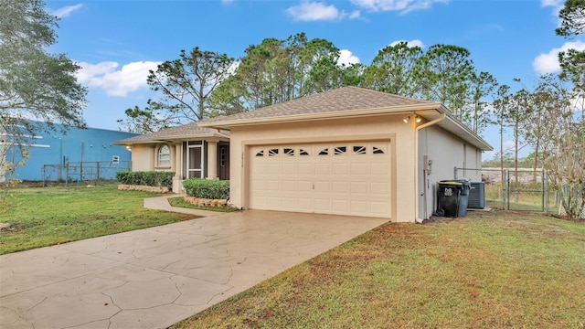 view of front of house featuring a front yard, a garage, and central air condition unit