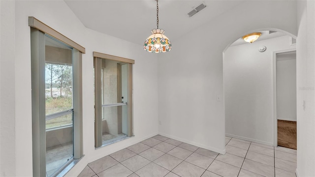 spare room featuring light tile patterned floors