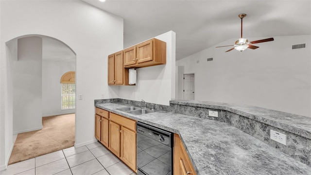 kitchen featuring ceiling fan, dishwasher, sink, vaulted ceiling, and light carpet